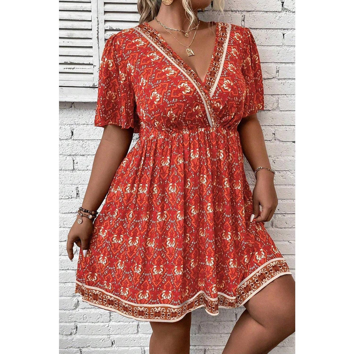 Orange Plus Size Printed Surplice Neck Empire Waist Flowy Mini Dress